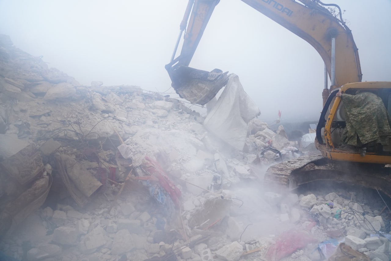 Machinery digs through rubble in Afrin District, Aleppo Governorate, Northwest Syria after the earthquake