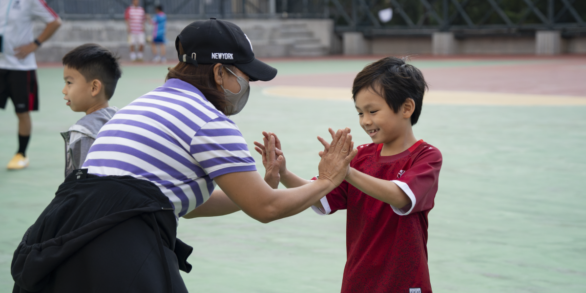 parent high five with child