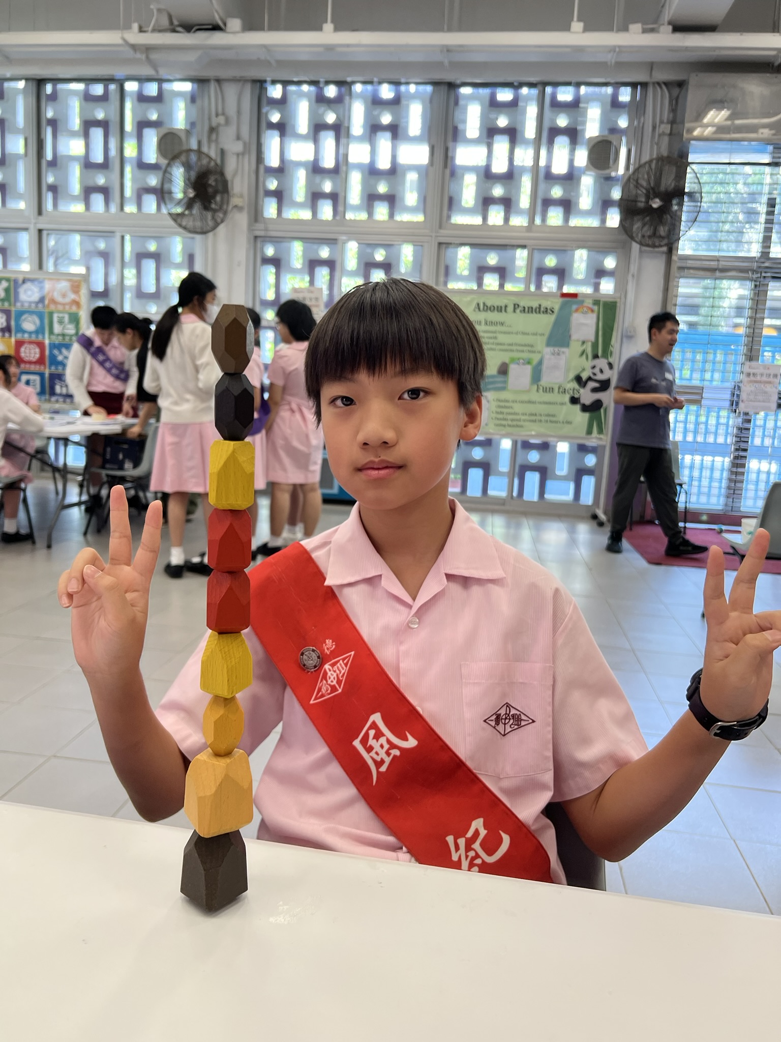 Chan is helping his grandmother storing dried fish given by Save the Children
